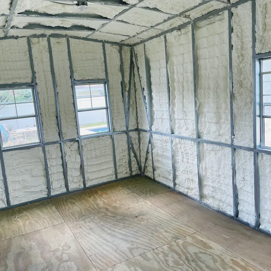 Closed-cell spray foam insulation applied to wall cavities in a residential project in Hempstead